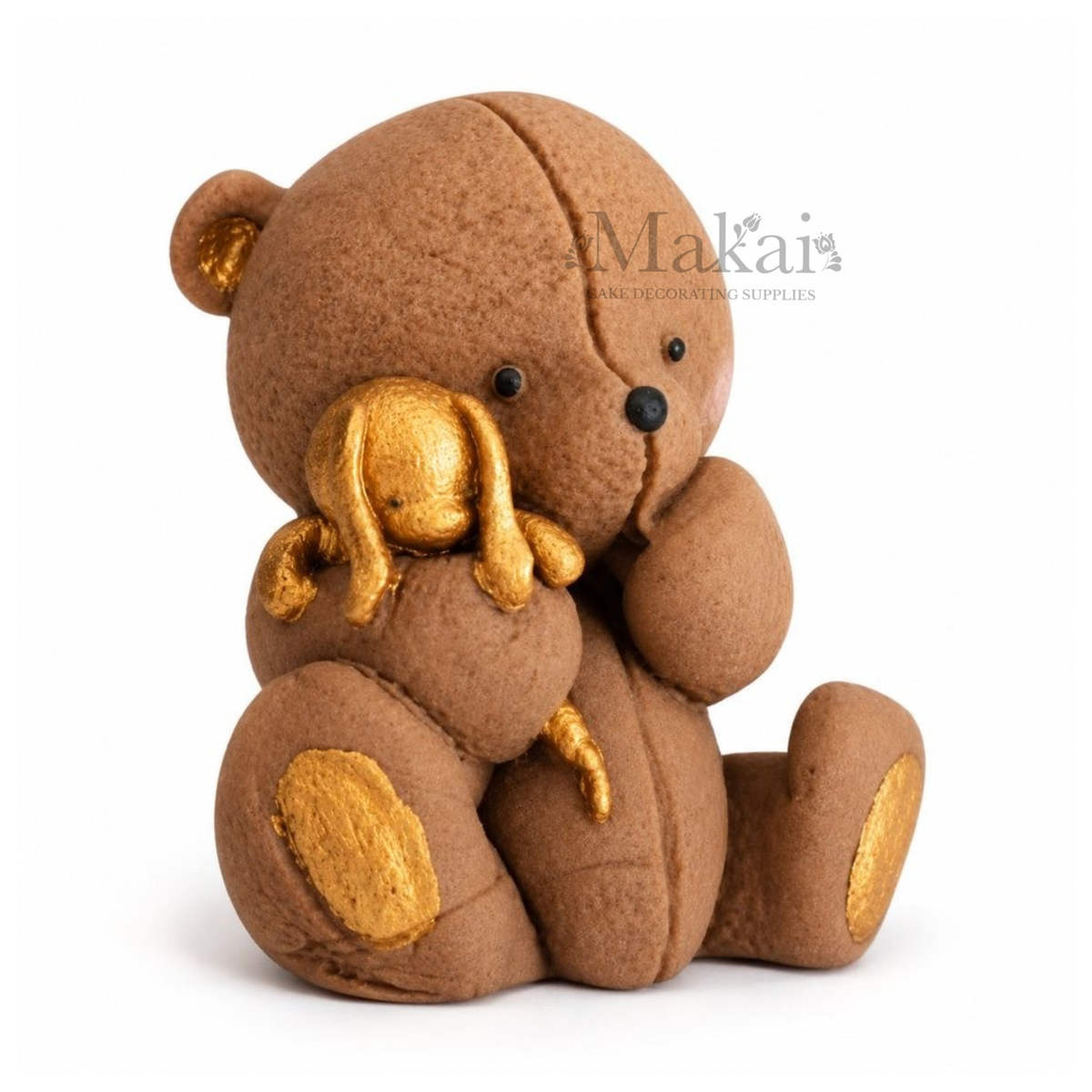 Brown teddy bear holding a gold bunny fondant cake topper for baby and children's celebration cakes