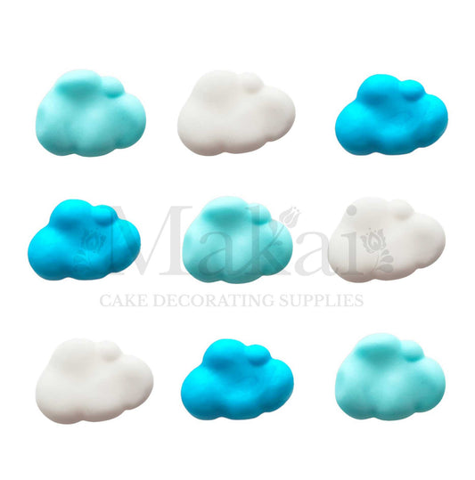 Blue and white fondant cloud decorations arranged in a mixed nine-piece set.