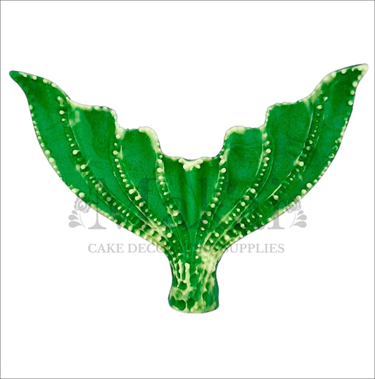 Edible mermaid tail cake topper in two-tone green with detailed texture, perfect for ocean and fantasy cake designs.
