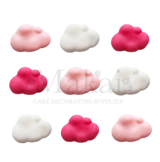 Bright and pastel pink fondant clouds mixed with white cloud decorations arranged in a nine-piece set