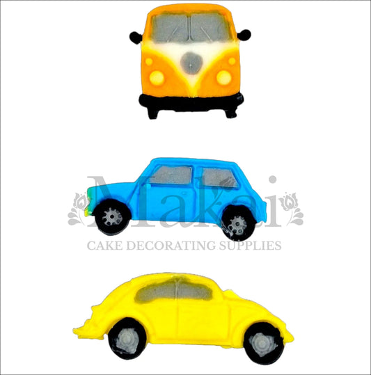Set of three vintage car cake toppers: yellow camper van, blue Mini, yellow beetle.
