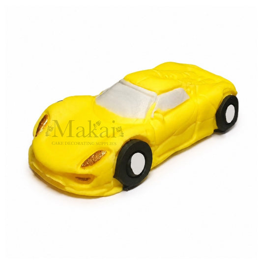 Yellow fondant sports car cake decoration for racing themed birthday cakes